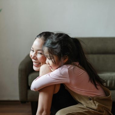 Photo of Girl Hugging Her Mom