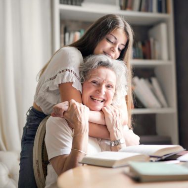 Woman Hugging Her Grandmother