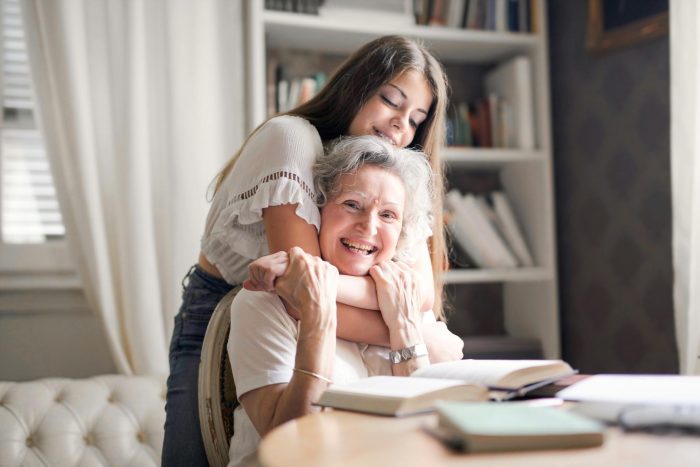 Woman Hugging Her Grandmother